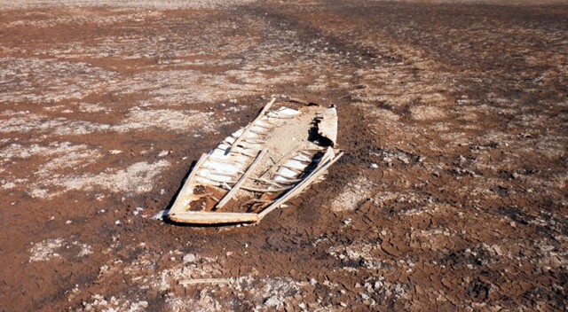 One of two sunken boats, exposed by the receding lake water.