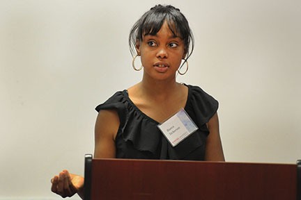 Student presenter Bianca Dickerson speaks at a podium