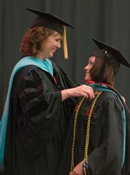 graduate being hooded