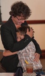 Walker, DNP embraces son at ceremony