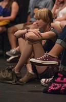 Student director Elizabeth Riley watches her actors from the floor of Hawes Studio Theatre 