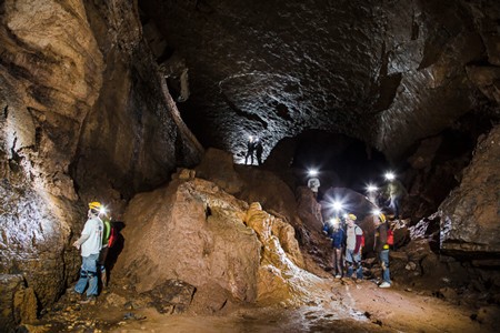 Students enrolled in the Wilderness Institute test their caving skills at Starnes Cavern.