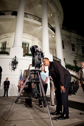 A White House photo shows President Barack Obama observing the skies from a telescope on the South Lawn of the White House. 