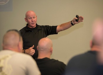 RUPD officers listen as they receive ALERRT training, which took place in Cook Hall and other locations across campus.