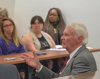 Judge James P. Jones talks with students during the Radford University Prelaw Society event in the courtroom inside the College of Humanities and Behavioral Sciences.