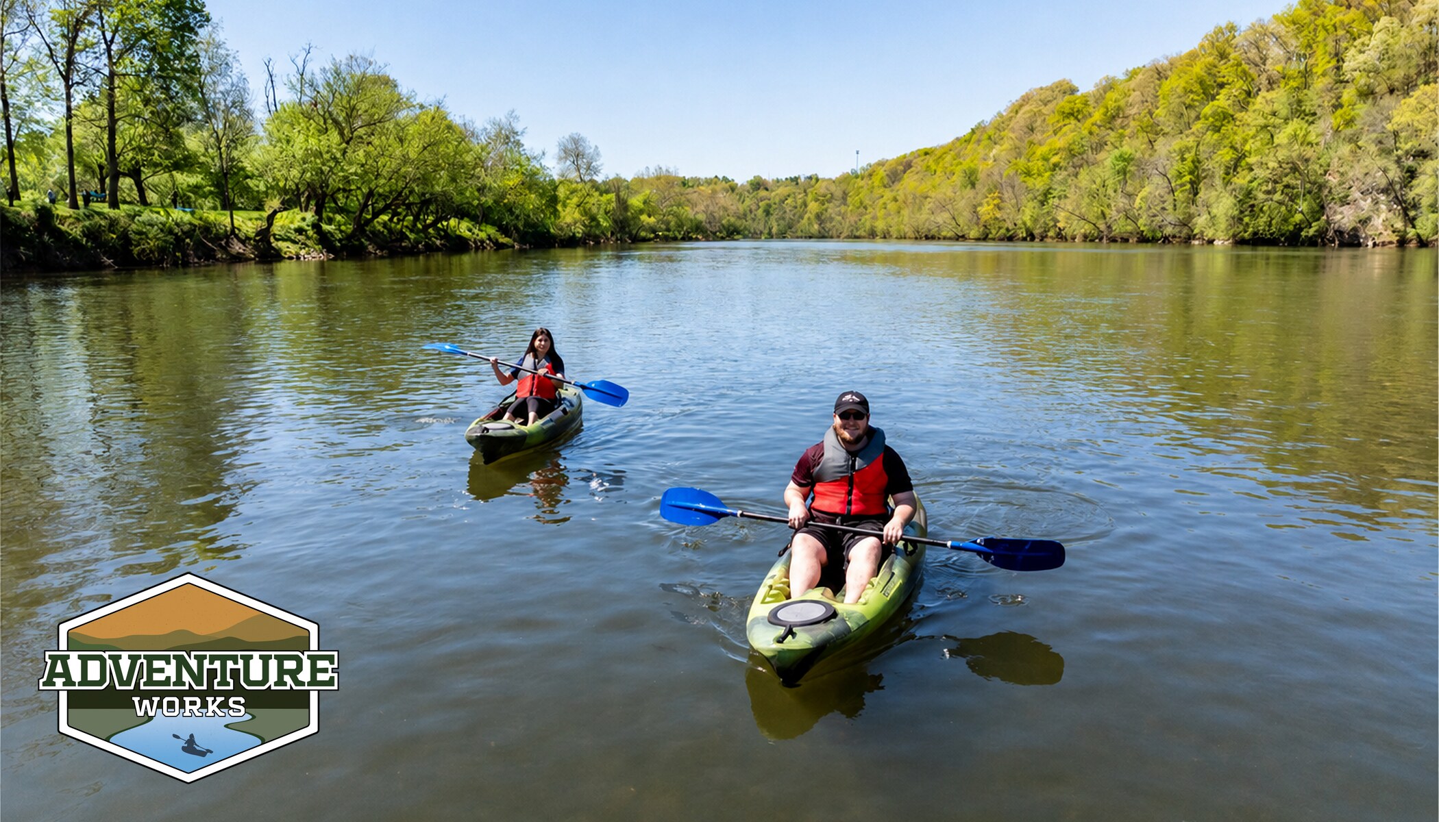 two people in kayaks floating on the New River