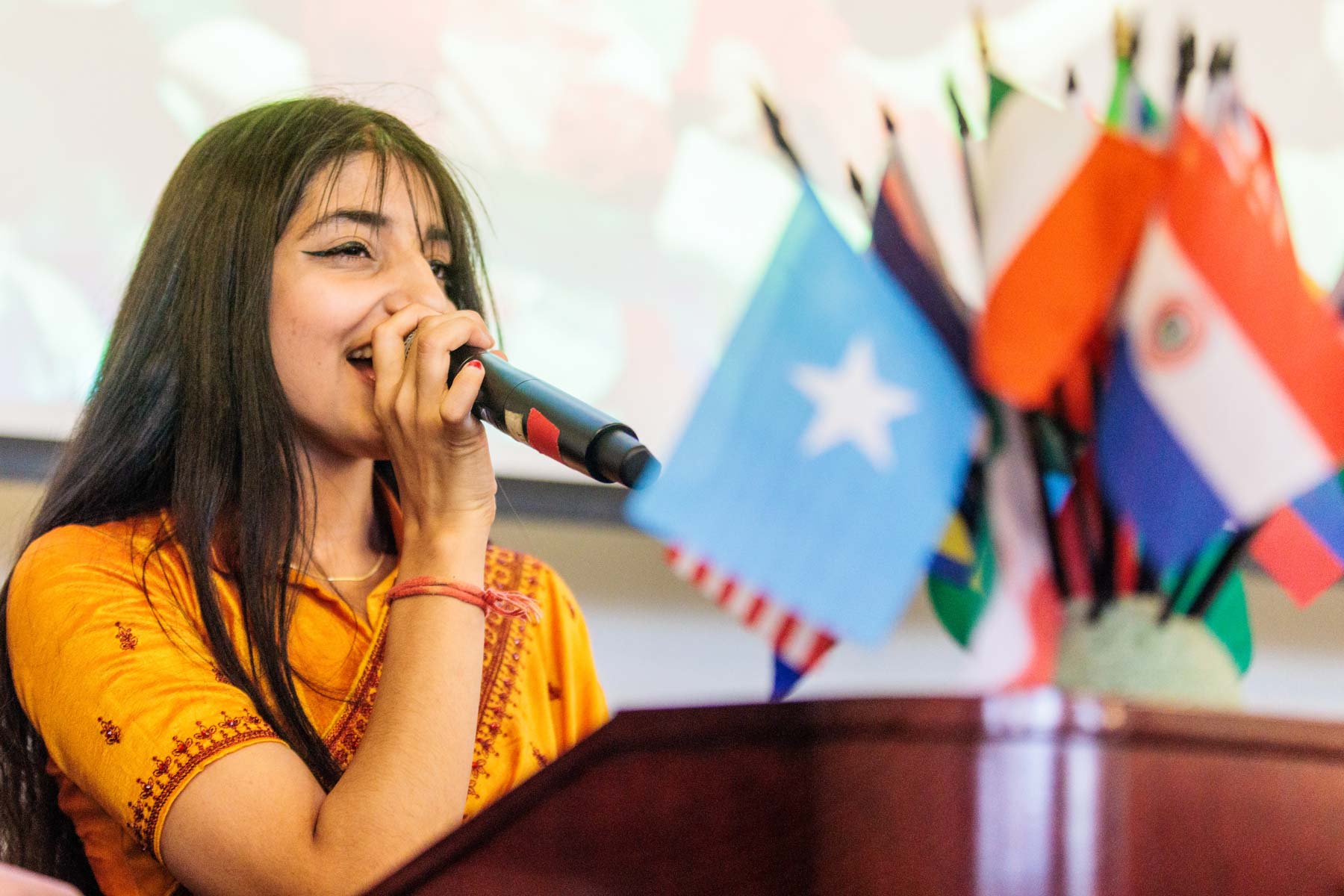 International student speaking at a public campus event.