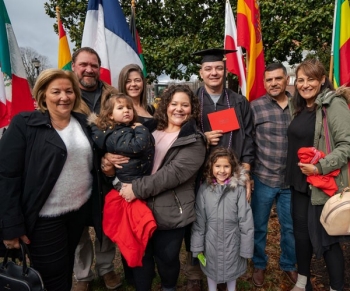 student with family at fountain