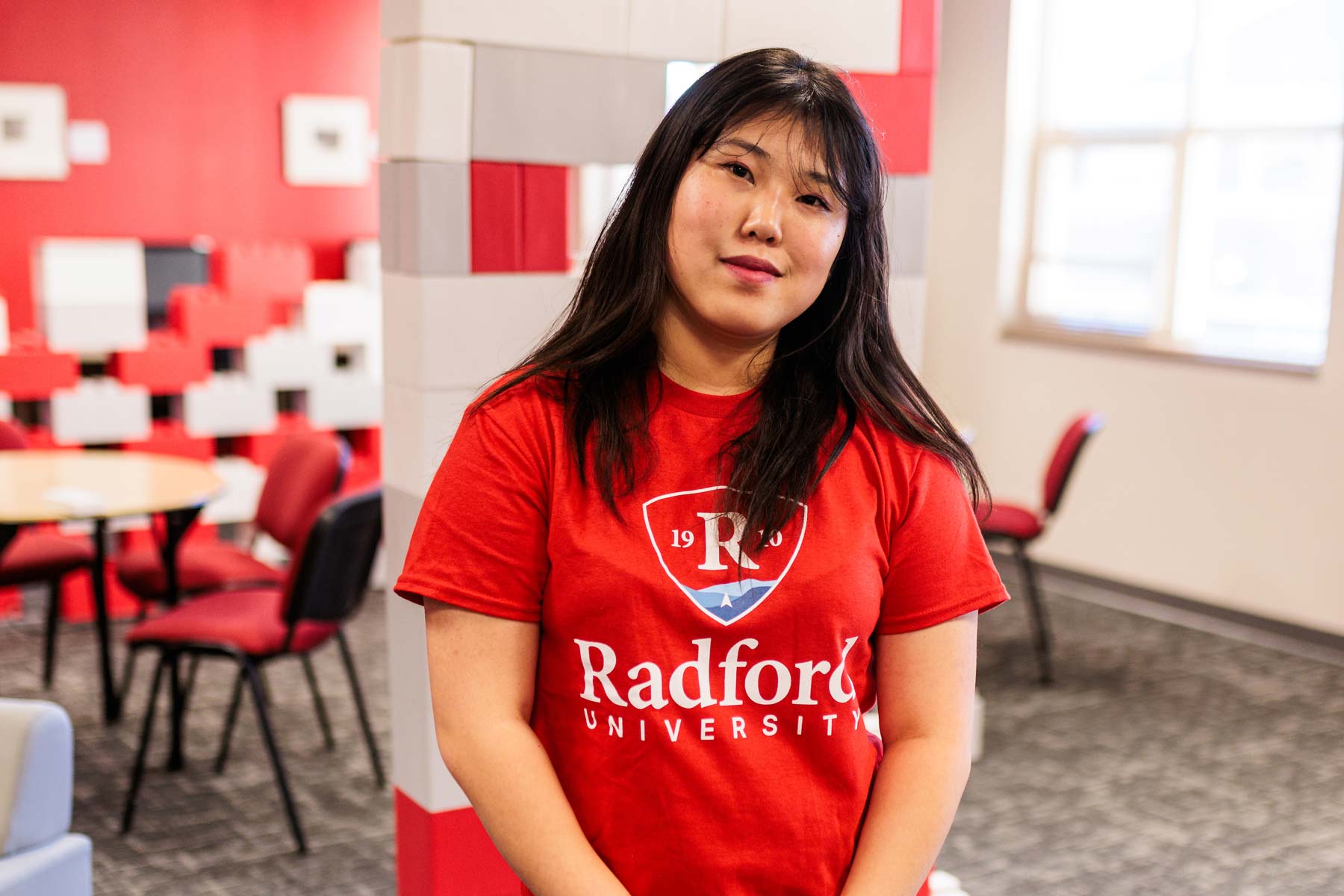 student in red Radford shirt in the Bonnie student center