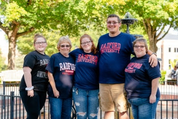 student with family at fountain