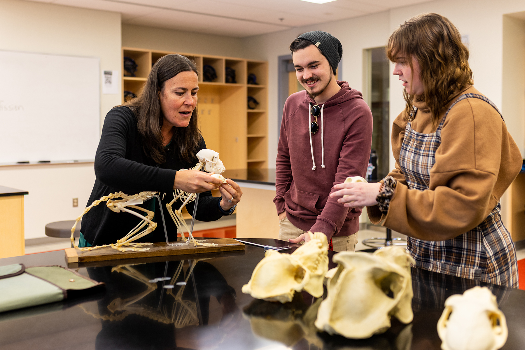 faculty helping students in a lab classroom