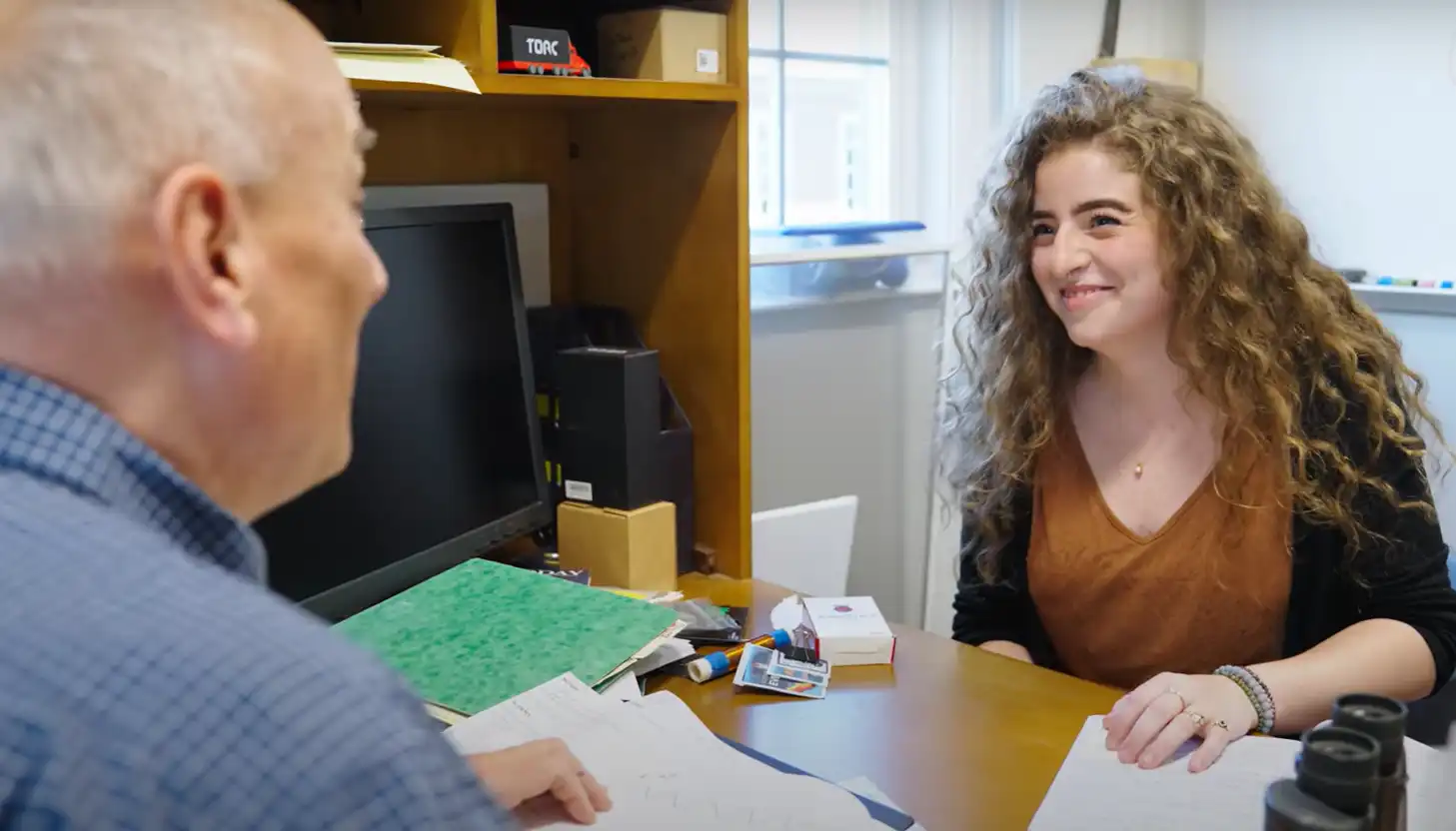 student chatting with professor