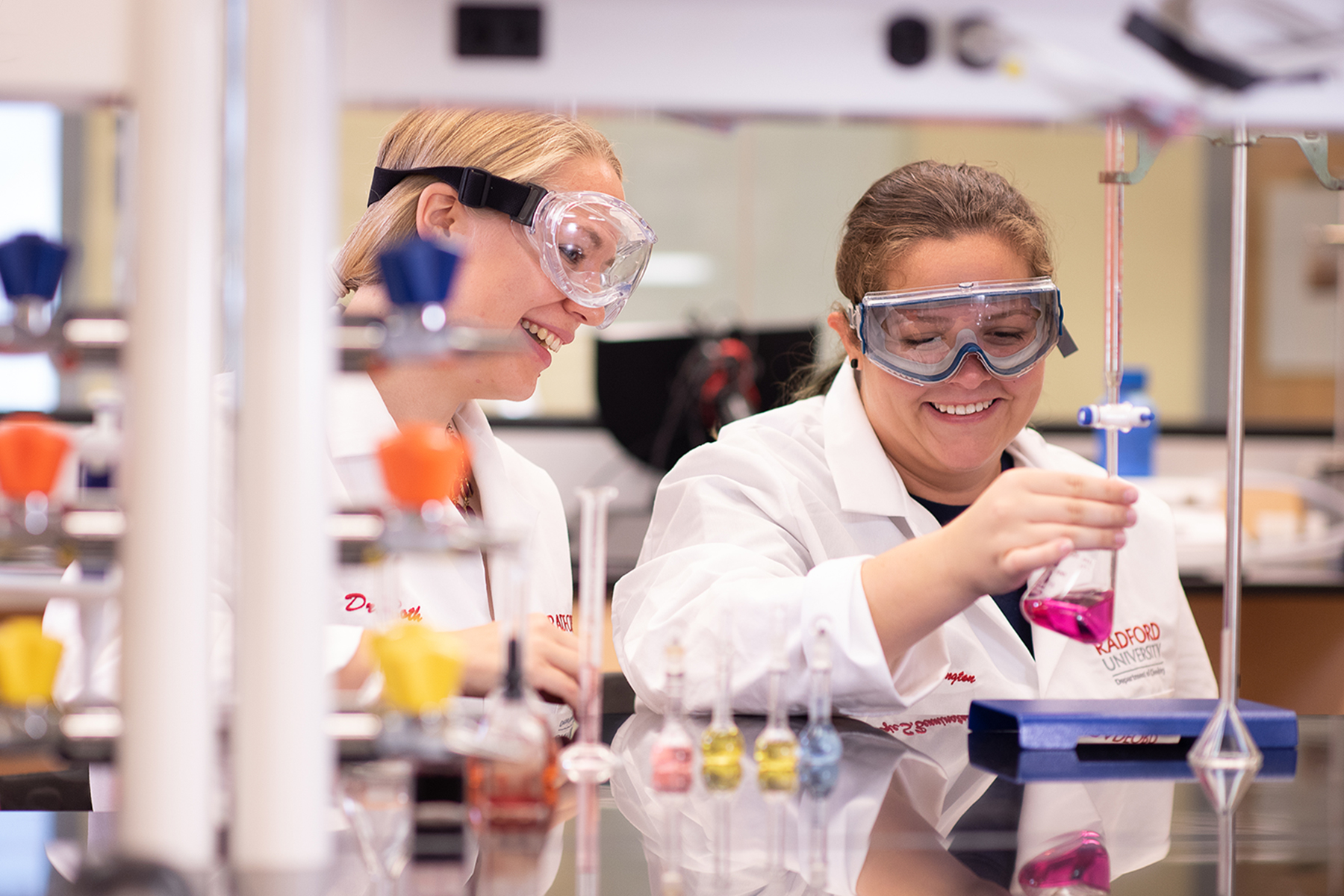 faculty advisor and student in lab 