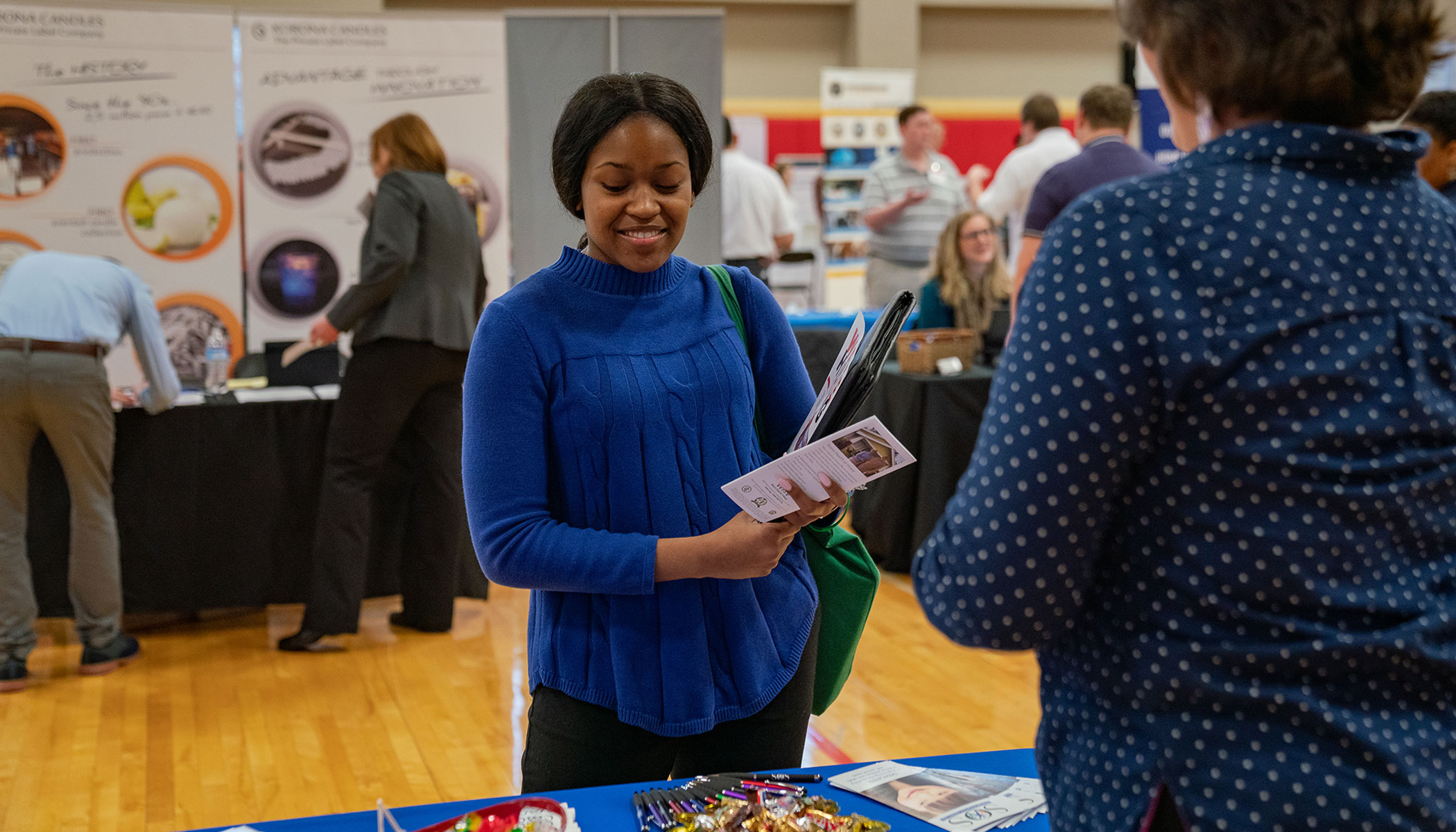 student talking to recruiter at career fair