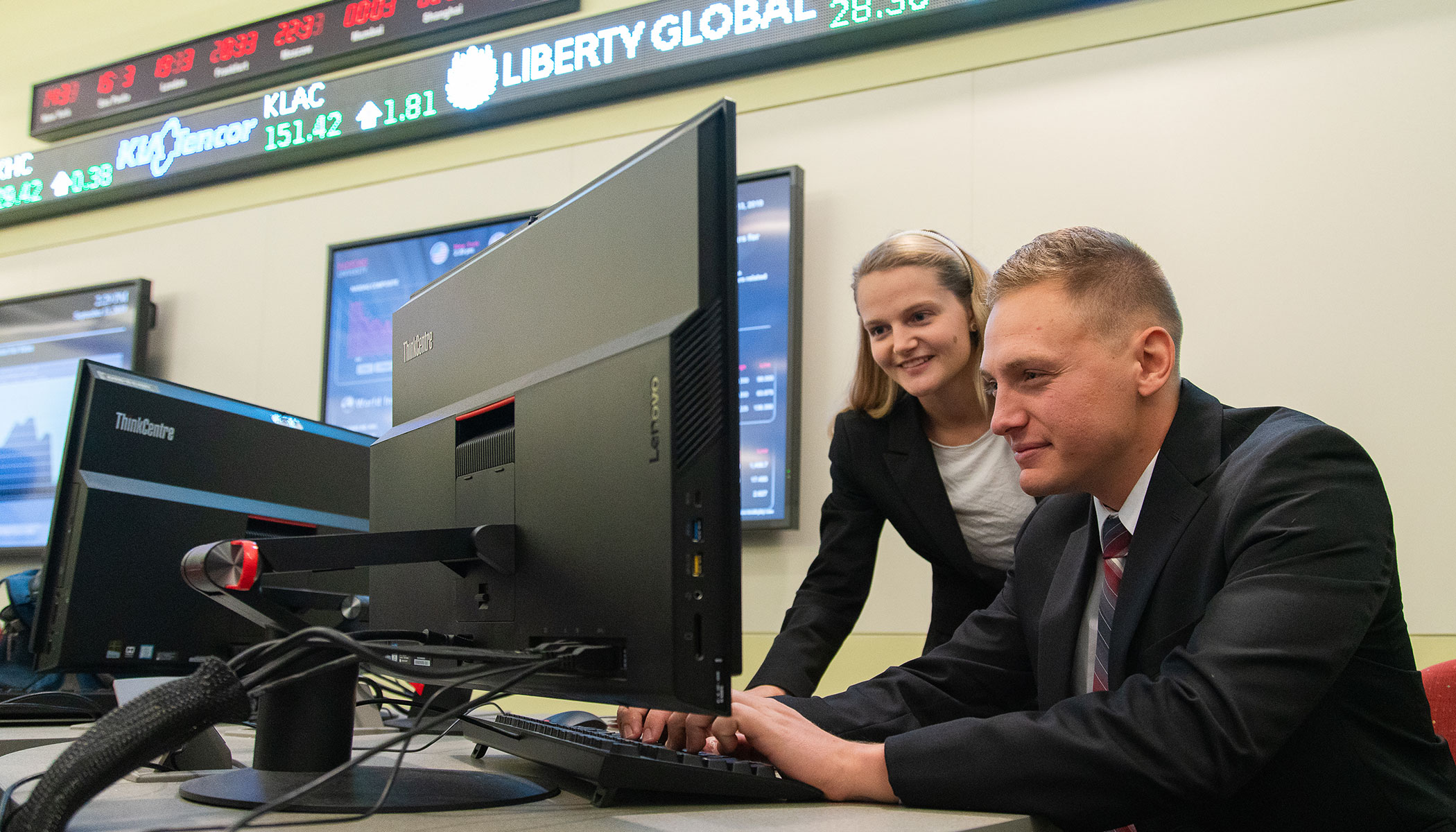 students looking at computer