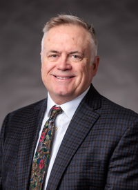 Headshot of John Travers