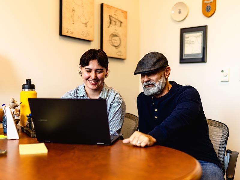 professor and student at computer