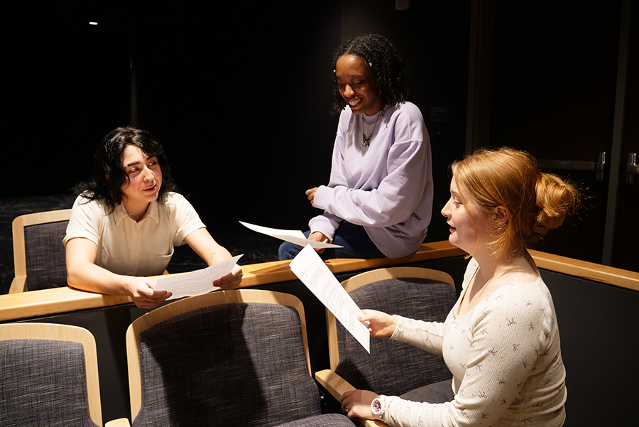 Actors Aspen Ramsey, Kyla Gilcrest and Sarah Lindsay Merriman review materials in preparation for their roles in “Die Schöne Müllerin.