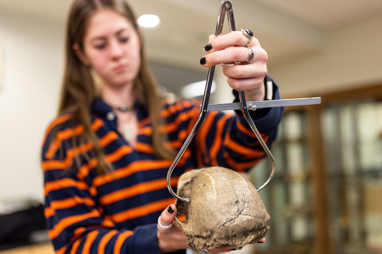 anthropology student with bones