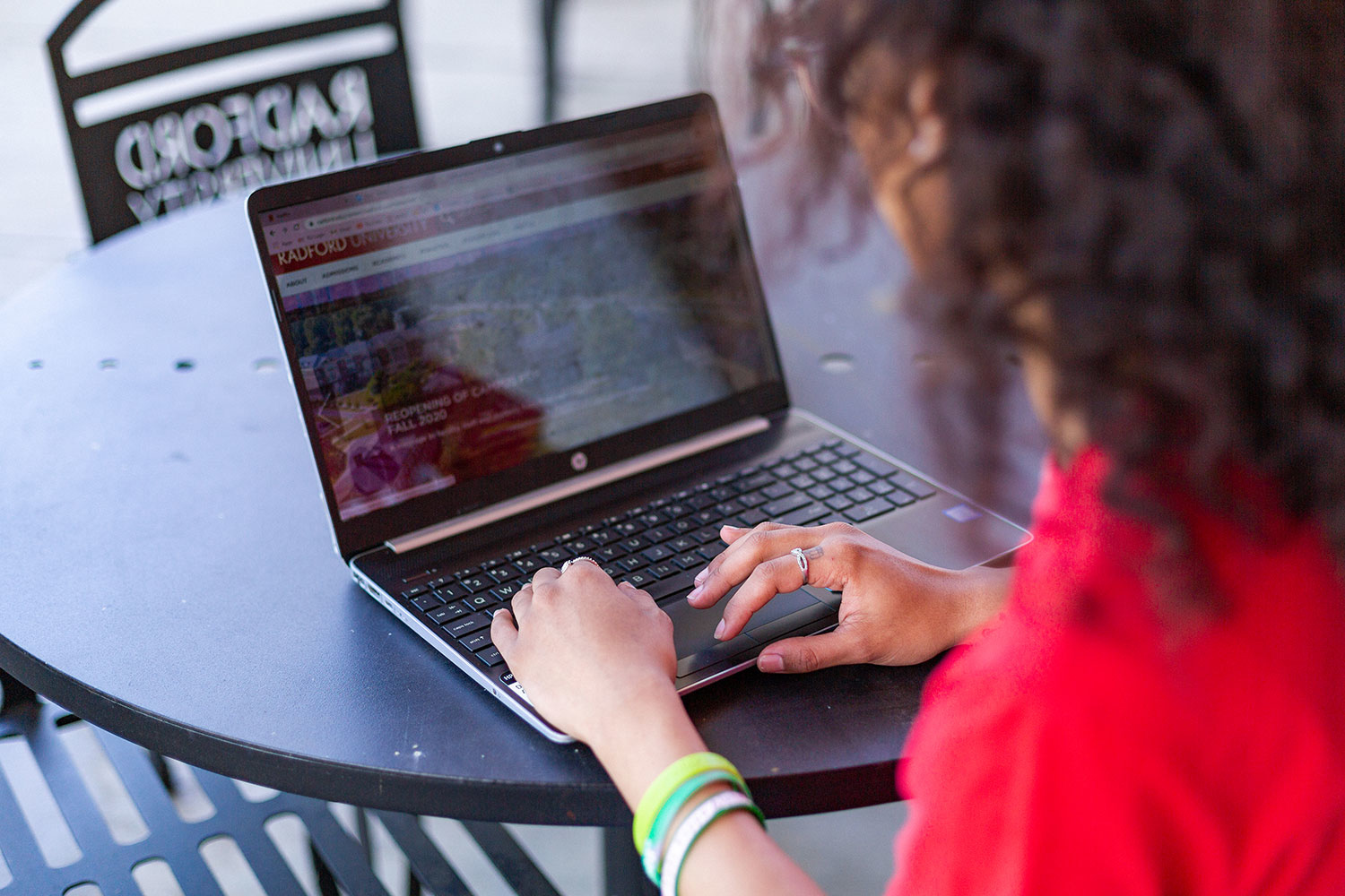 girl typing on laptop