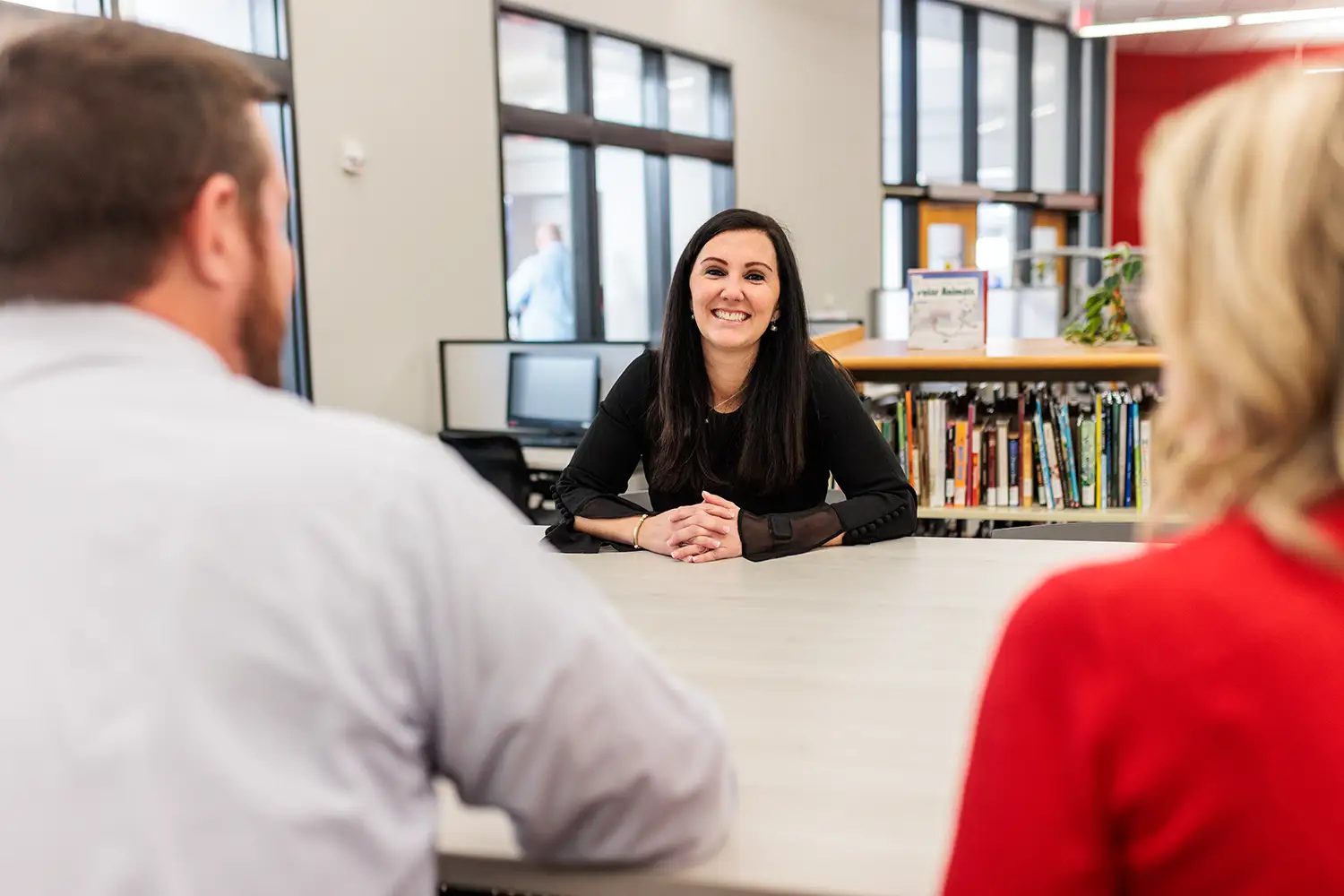 student talking with other students in Teacher Resource Center on campus