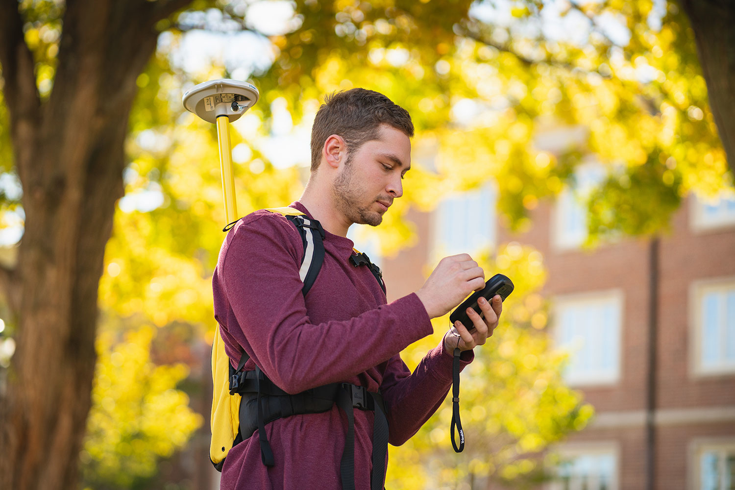 a student carrying a geocache