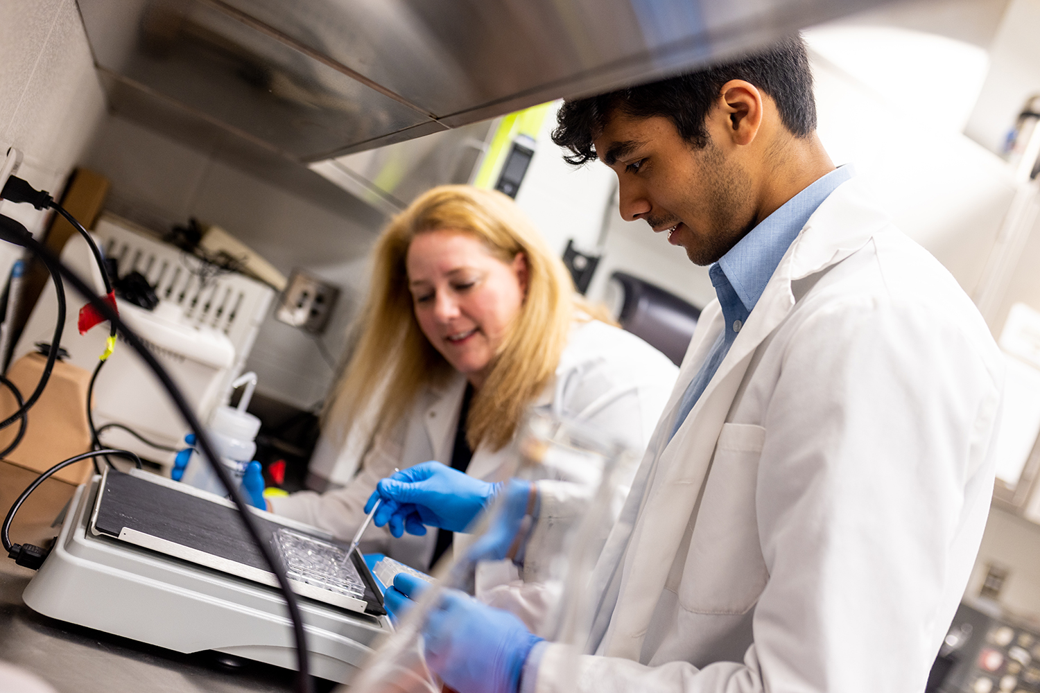 Student and professor in lab setting