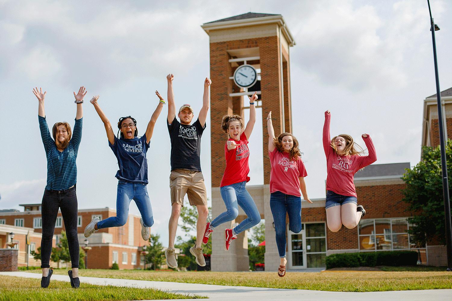 Students jumping in the air for a fun photo.