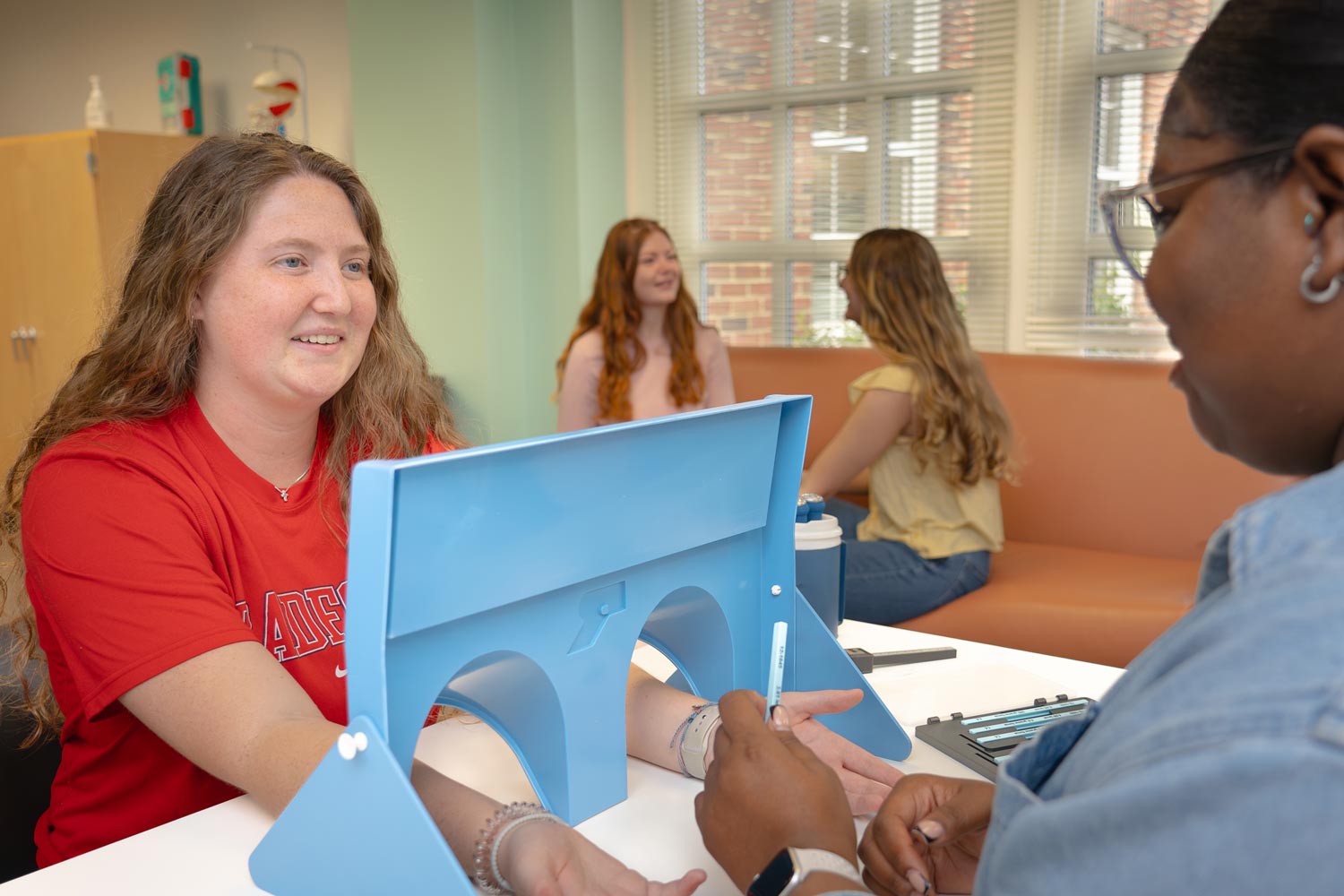 OT students in classroom lab